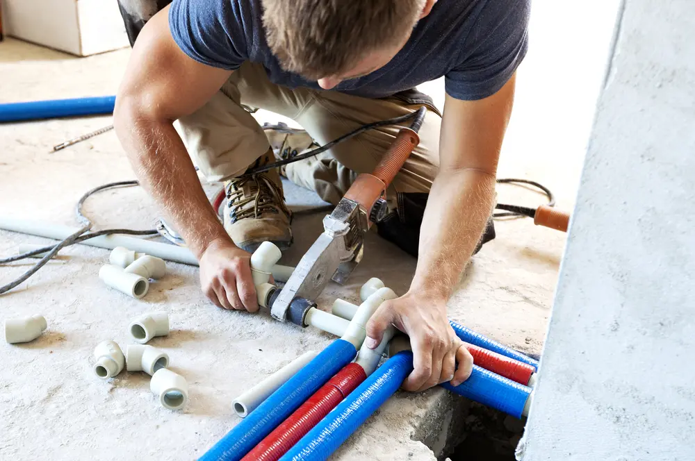 Plumber installing new code-compliant plumbing in a North Bay home