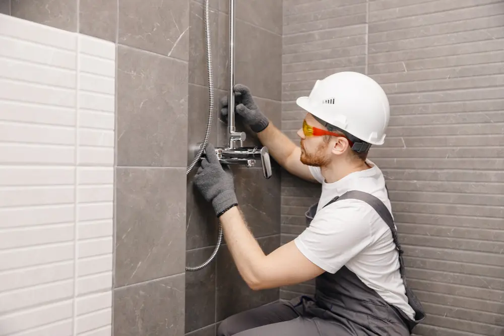 Rough-in plumbing lines in a new-construction home near North Bay