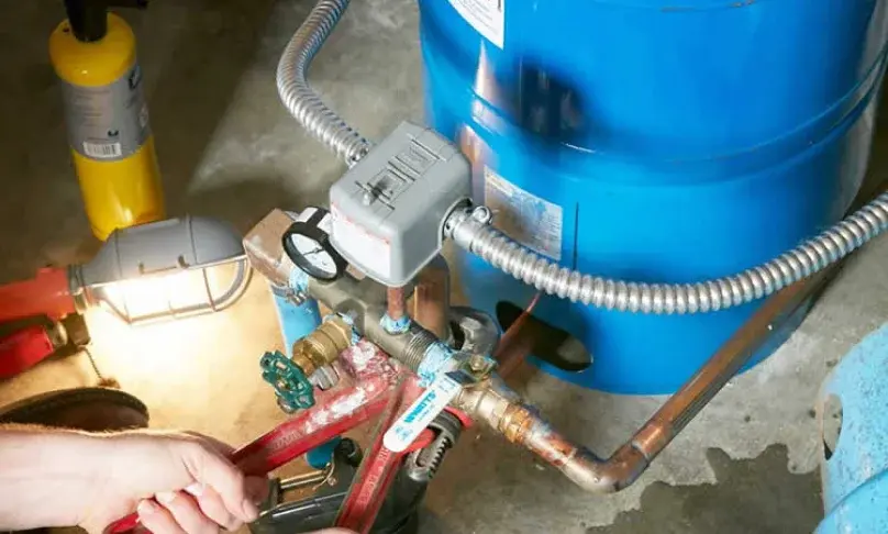 Plumber presenting credentials and insurance documentation to a homeowner before starting work