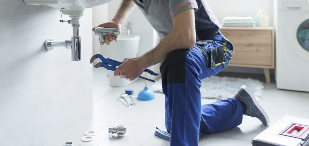 Poly-B Plumbing team providing service at a residential home, lakeside cottage, and commercial storefront