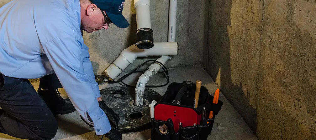 Professional plumber working on a residential plumbing system in Simcoe County